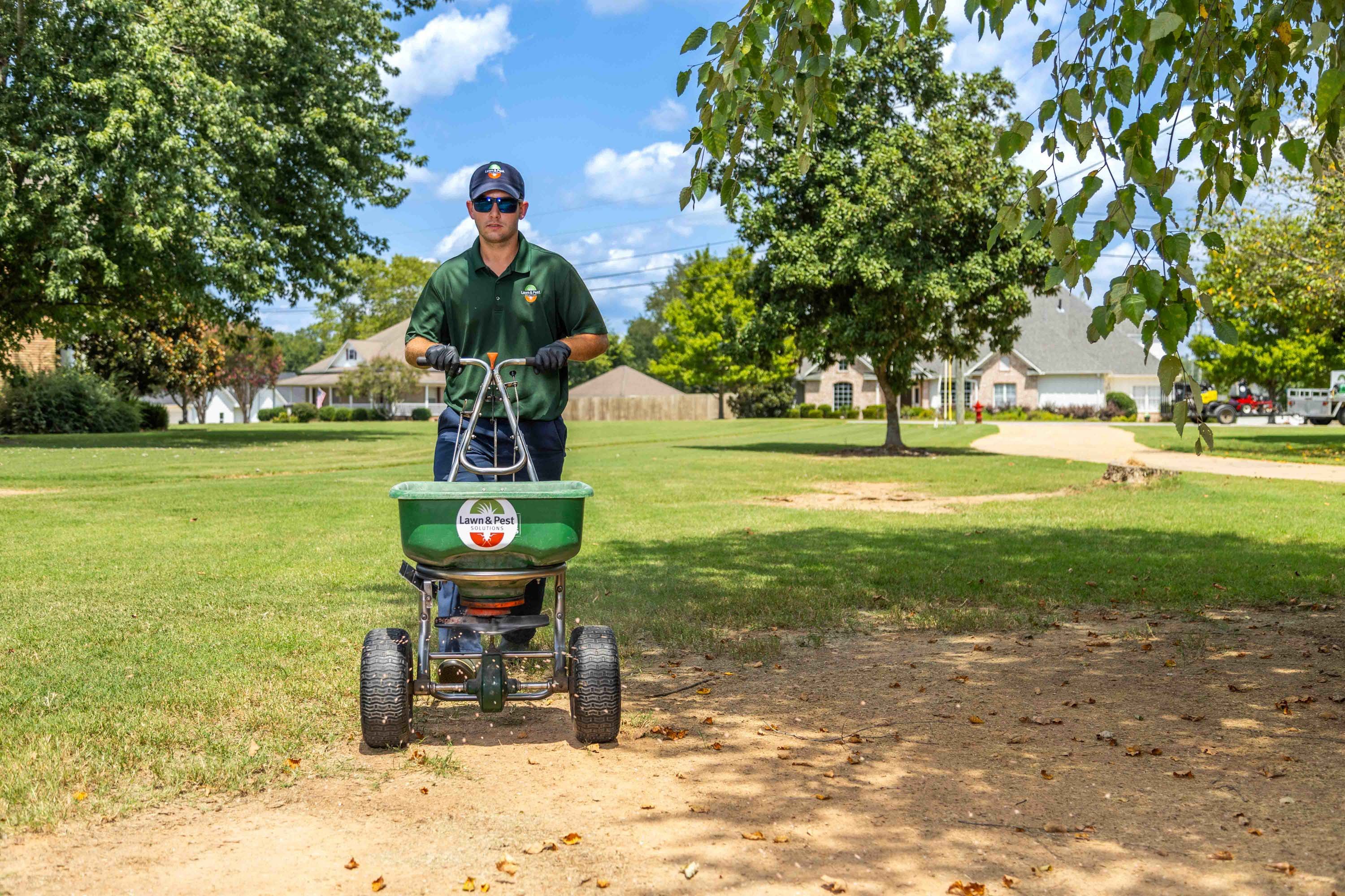 lawn care technician crew granular treatment fertilizer 3-1