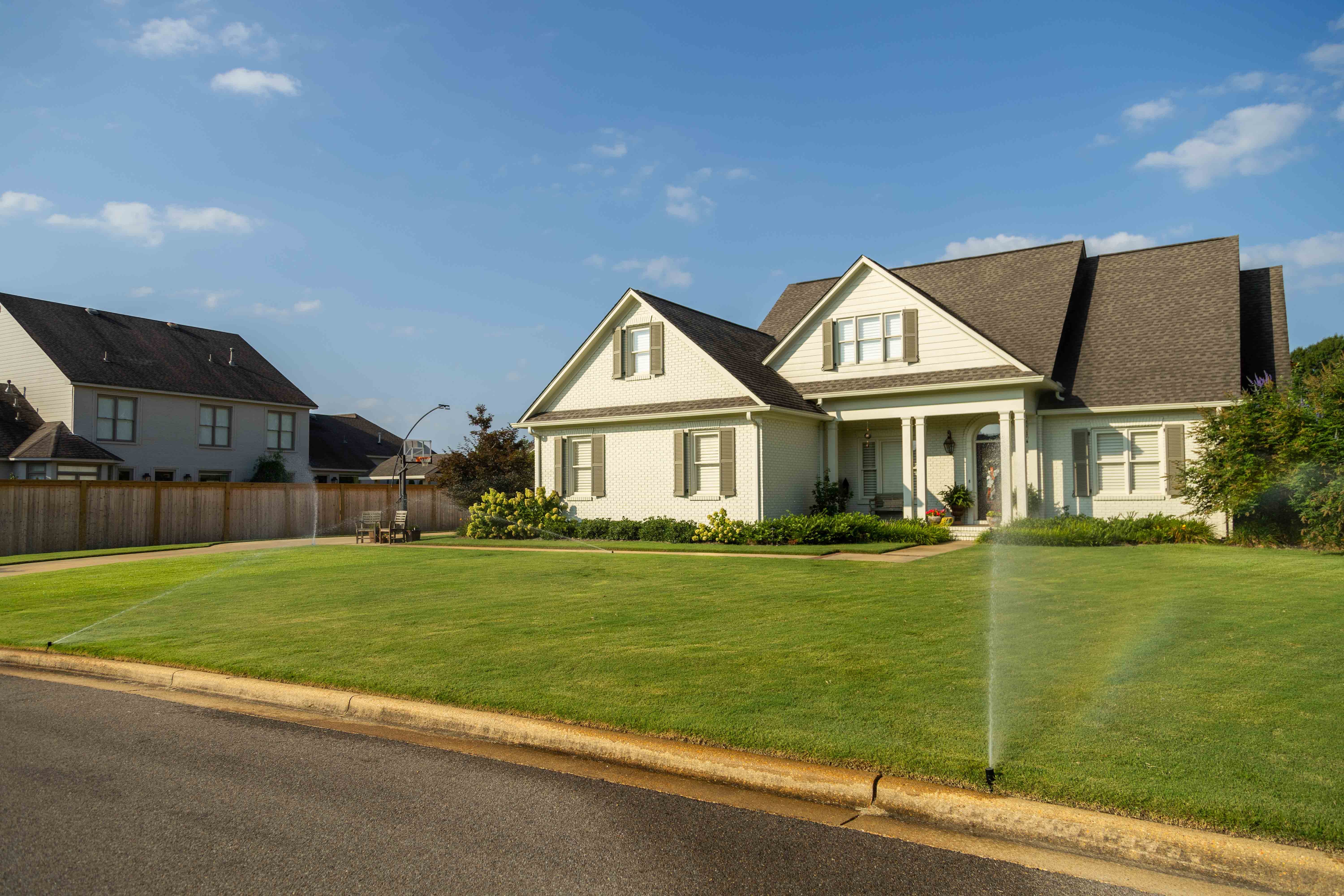 lawn sprinklers irrigating a nice memphis lawn