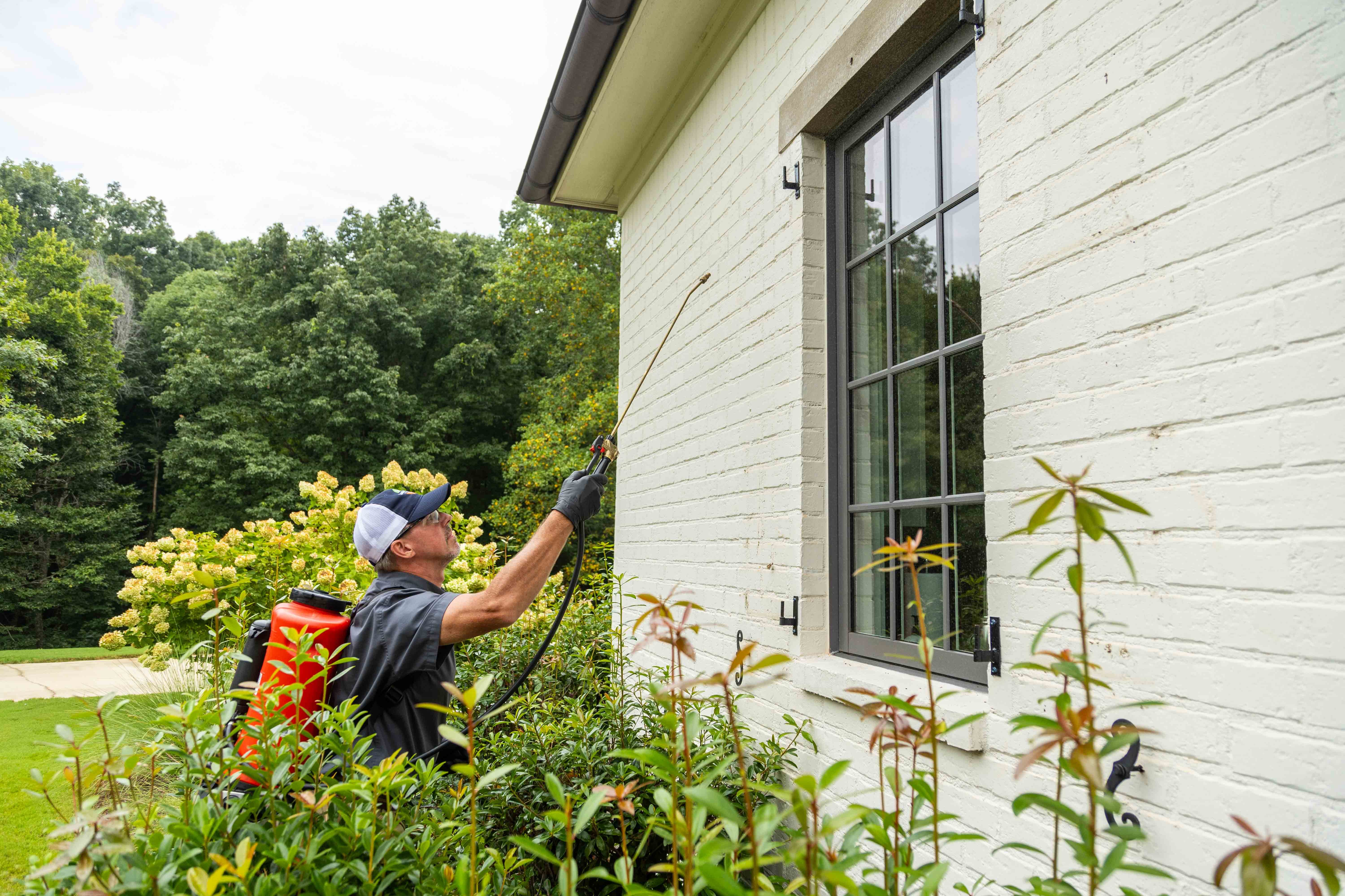 pest control tech crew spray tank treatment home front entry perimeter 13