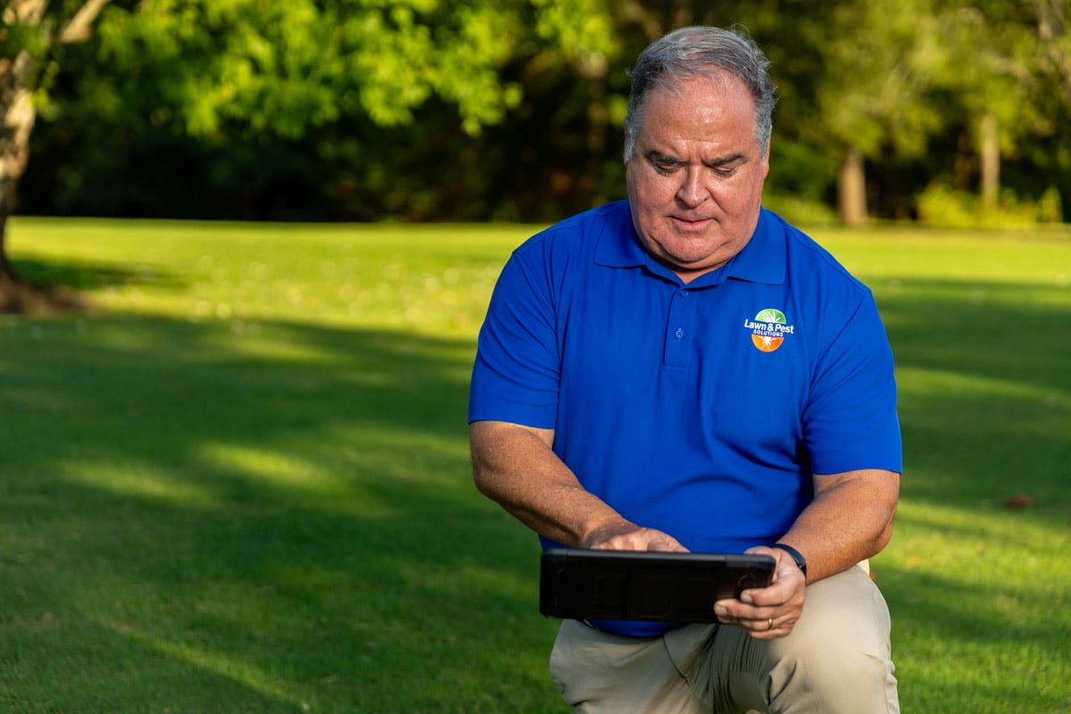 lawn care account manager measuring lawn tablet 2