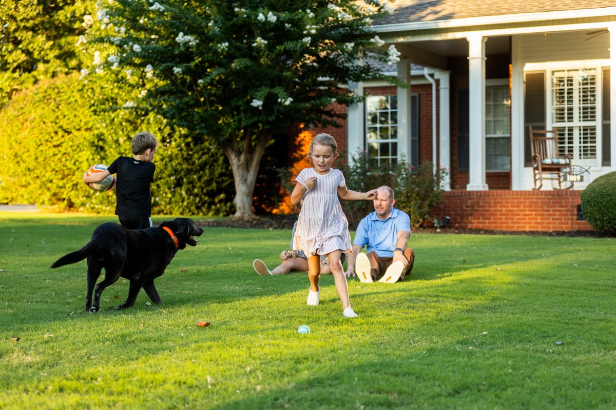 lawn care customers family dog in lawn nice lawn