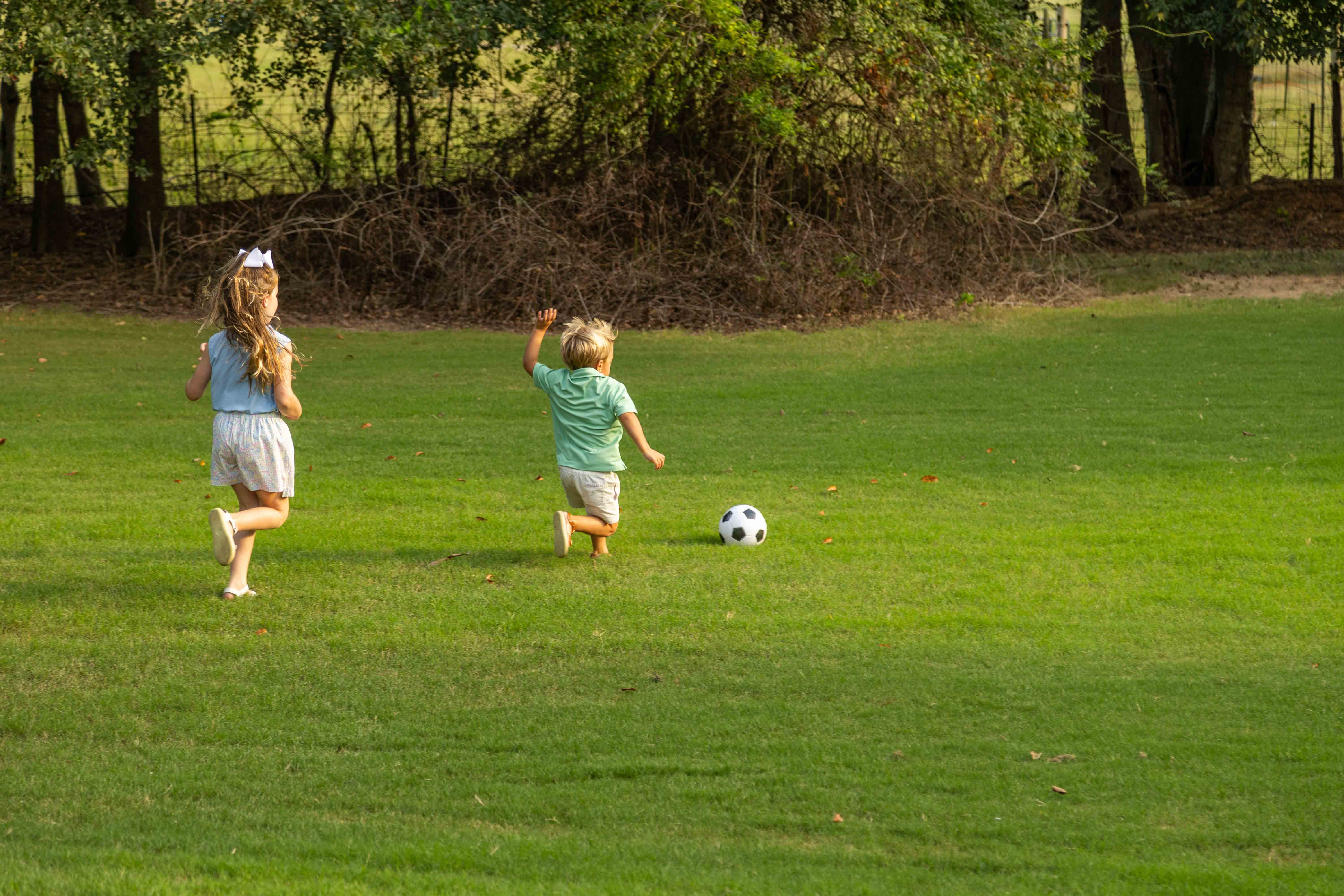 family playing soccer green lawn nice yard client 2