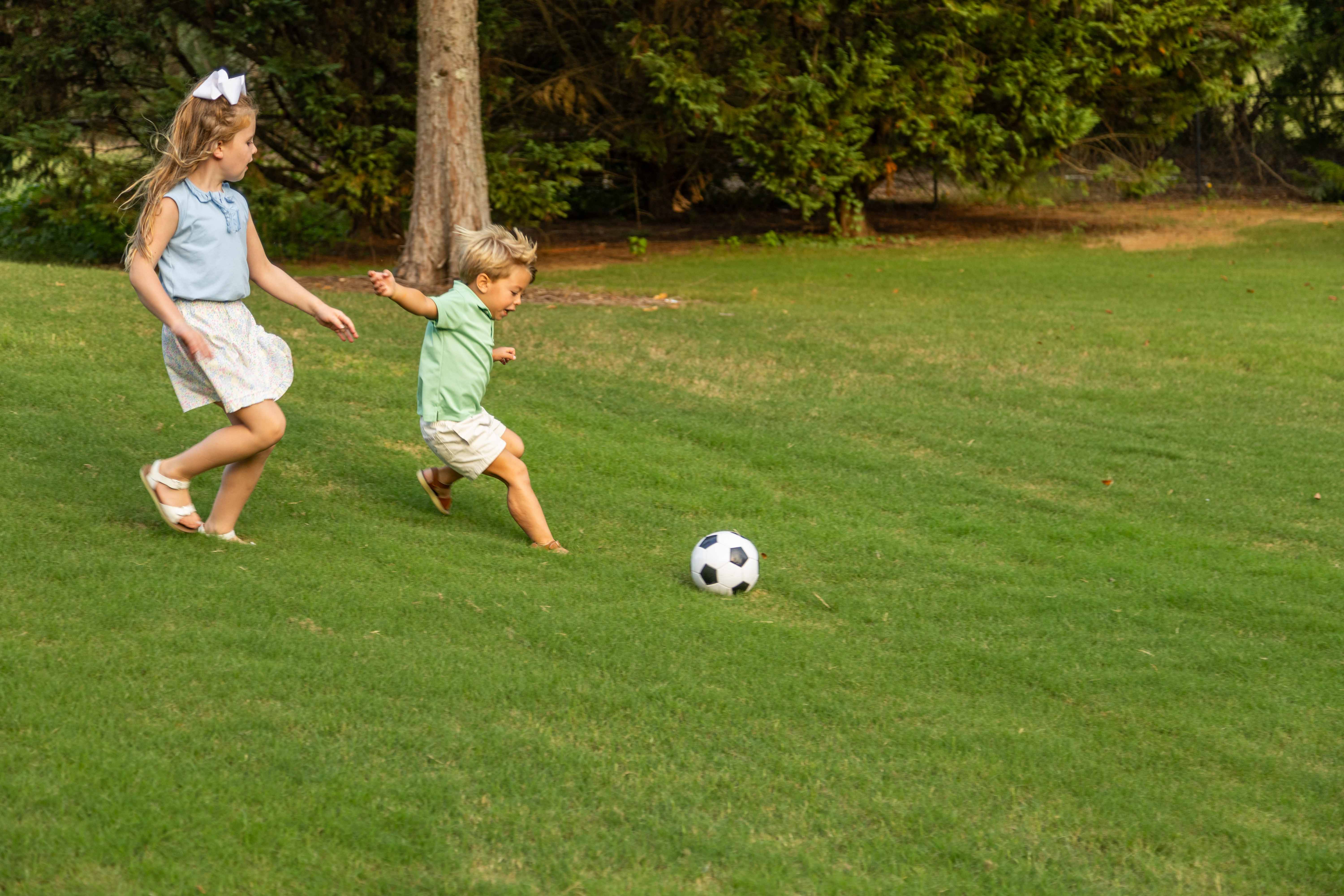 family playing soccer green lawn nice yard client 3