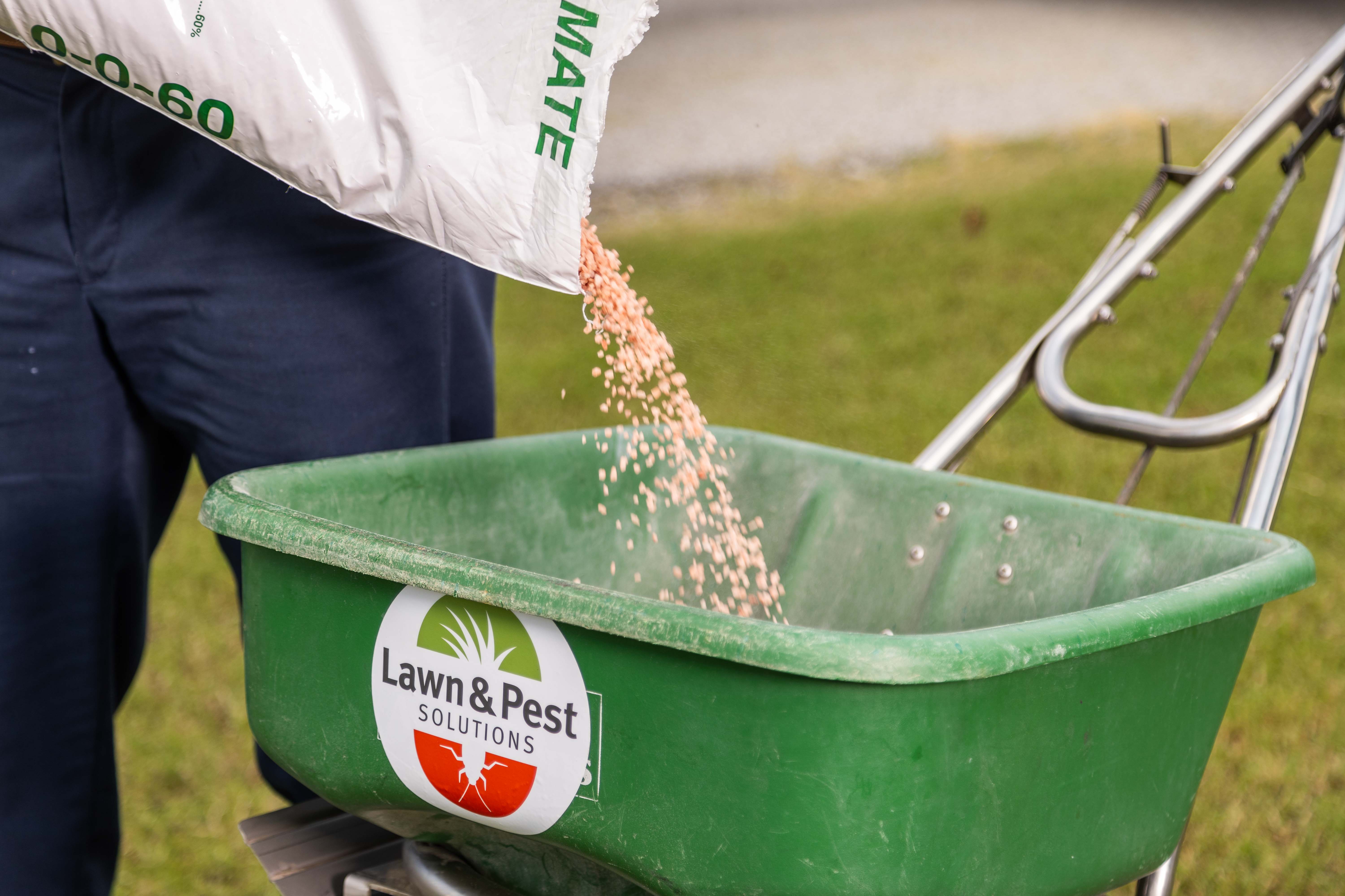 lawn care technician crew granular treatment fertilizer detail