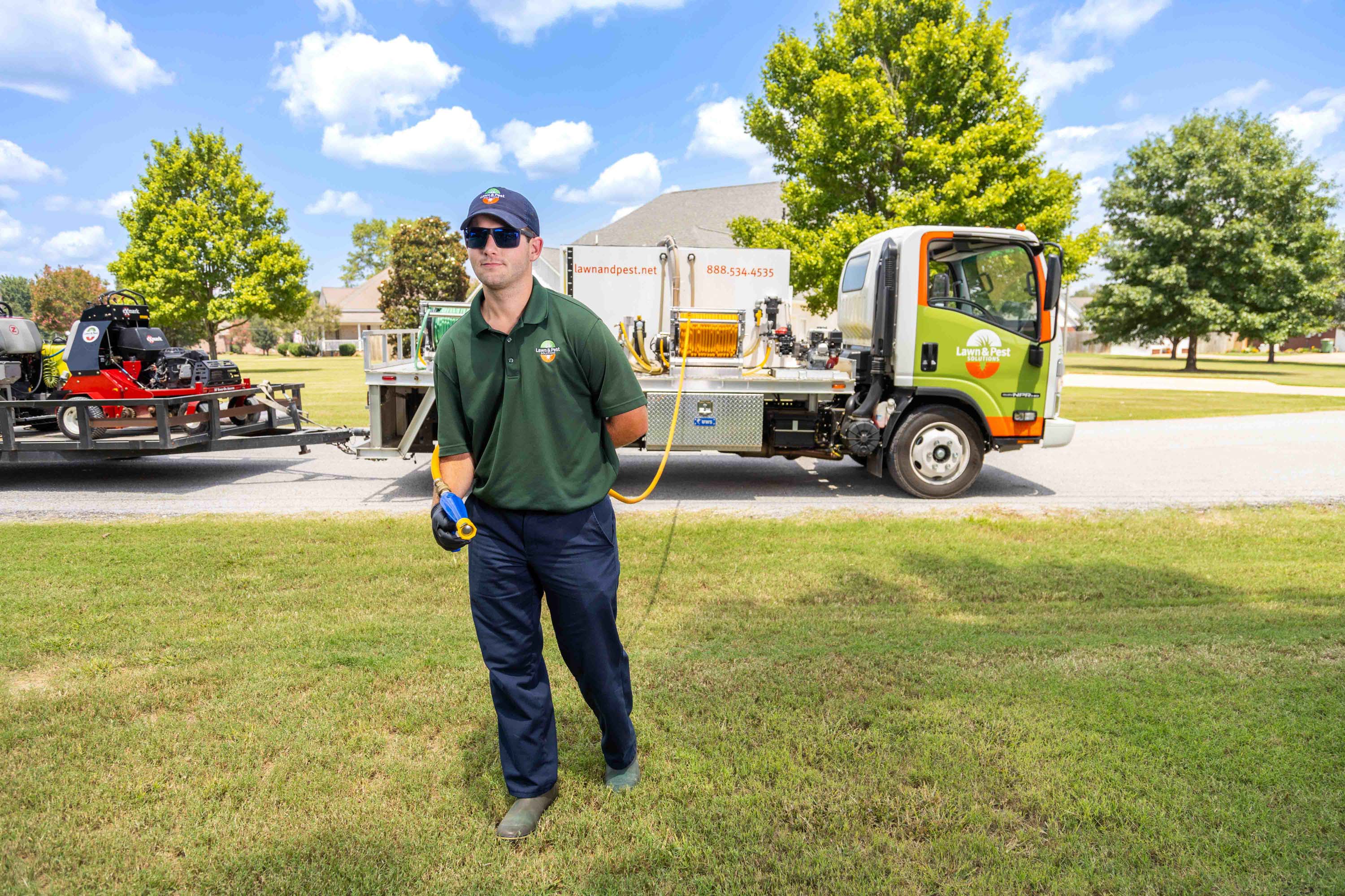 lawn care truck technician crew spray hose treatment yard 2-1