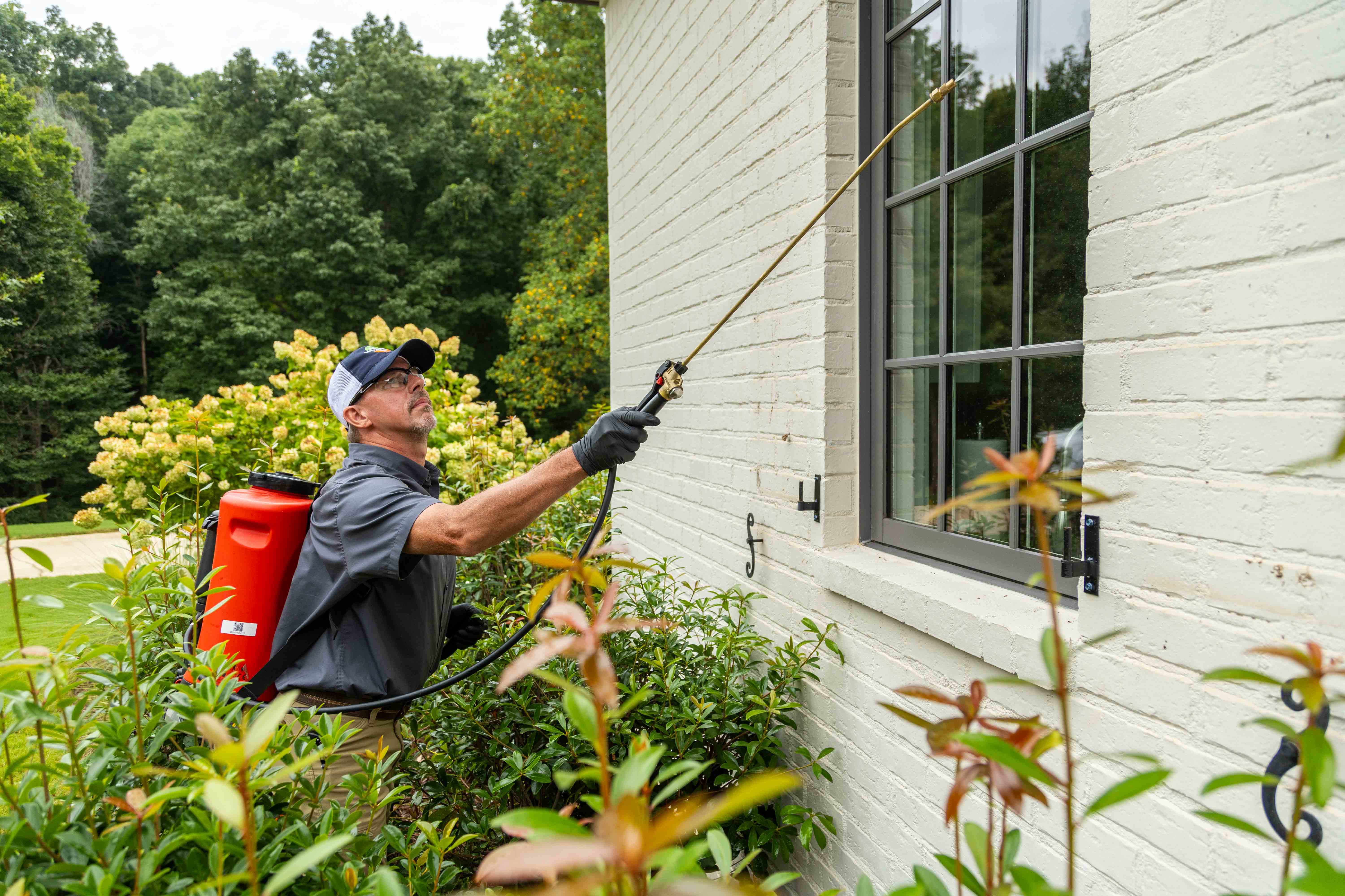 pest control tech crew spray tank treatment home front entry perimeter 12